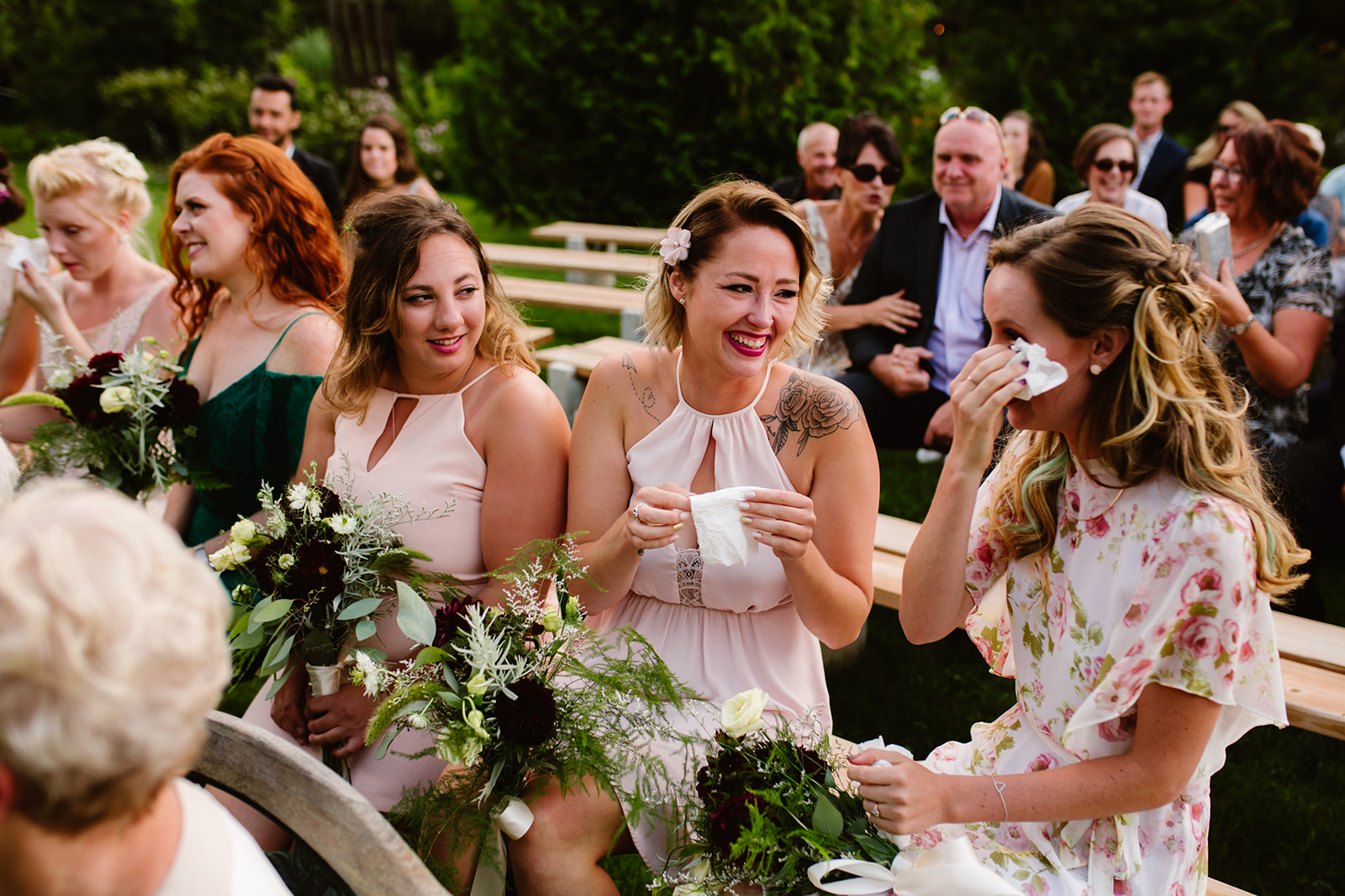 Bridesmaids wiping away tears at an Unplugged Ceremony
